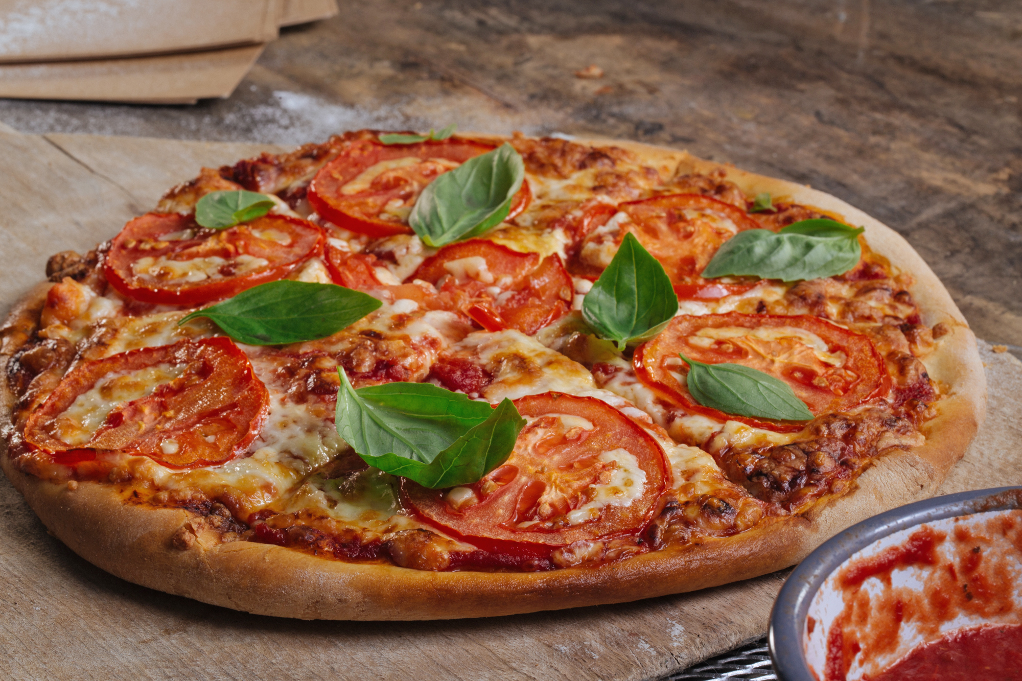 Margherita pizza on a wooden table.